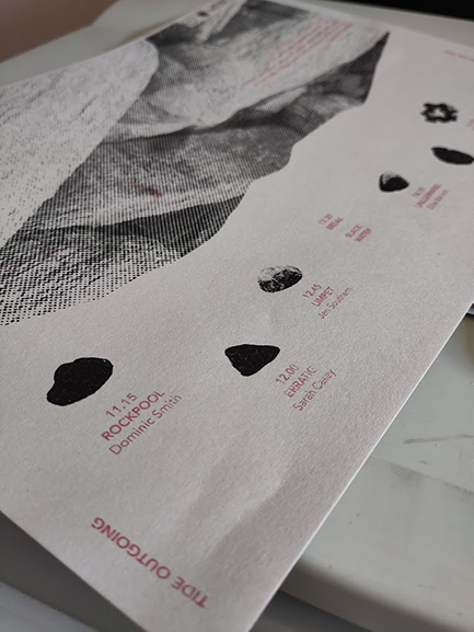 The inside of the riso printed pamplet with rocks printed in grey and text in red with the artists names